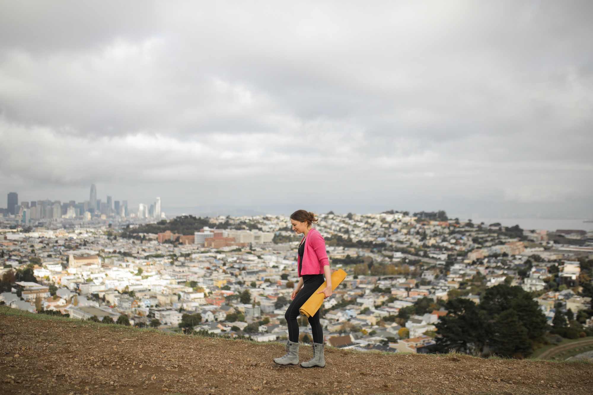 Maria Juliet walking with a yoga mat
